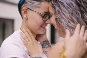Young lesbian couple kissing and showing affection