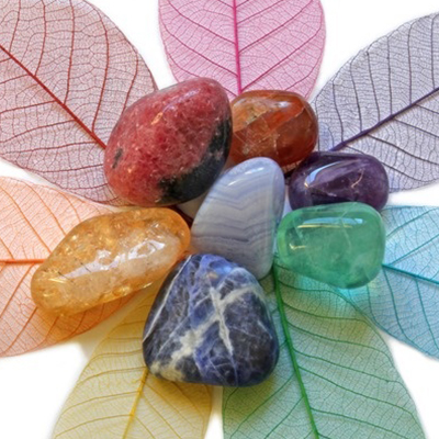 Energy stones on colored leaves