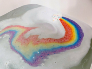 Cloud bath bomb fizzing a rainbow in bath water